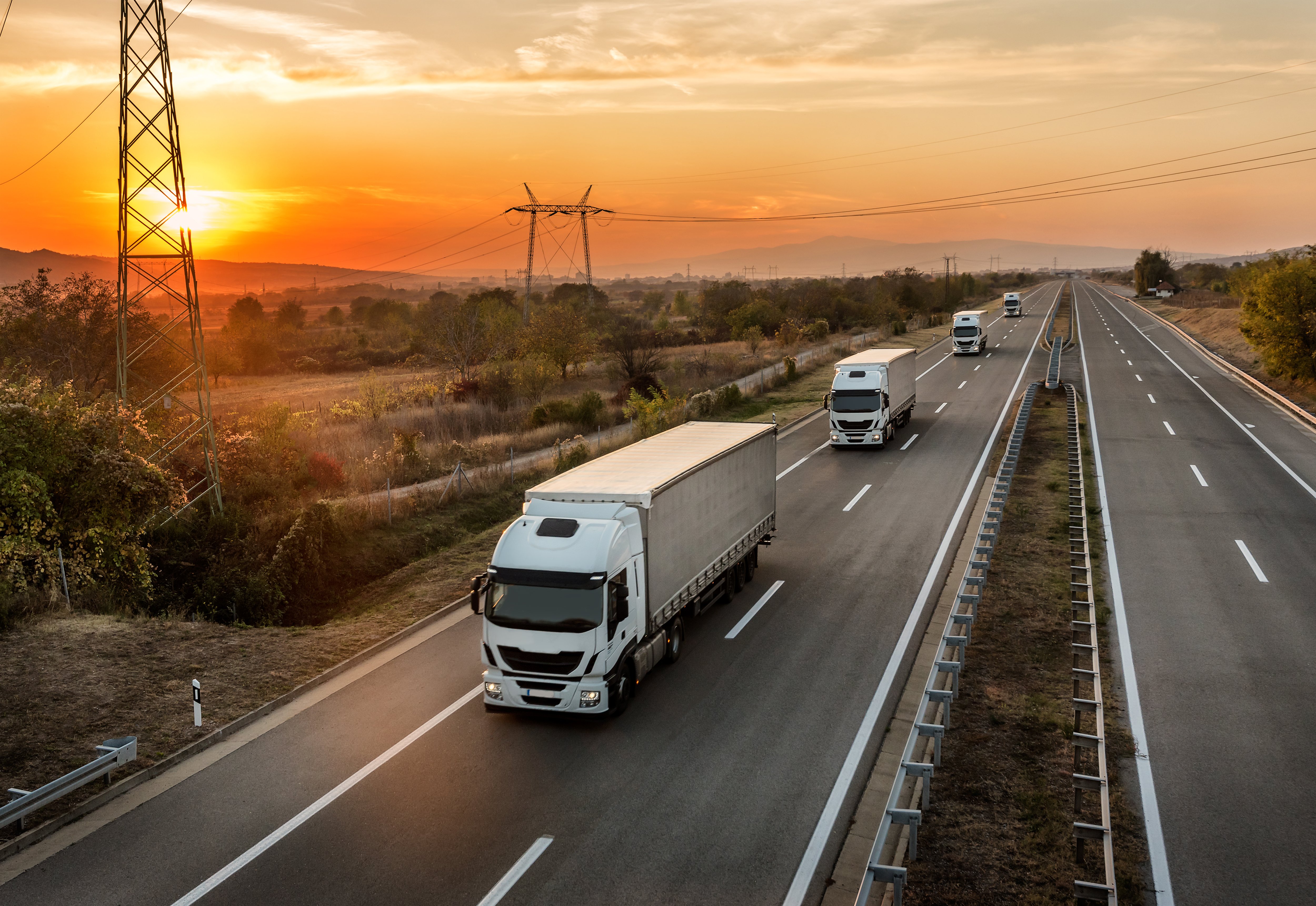 cars-road-against-sky-sunset