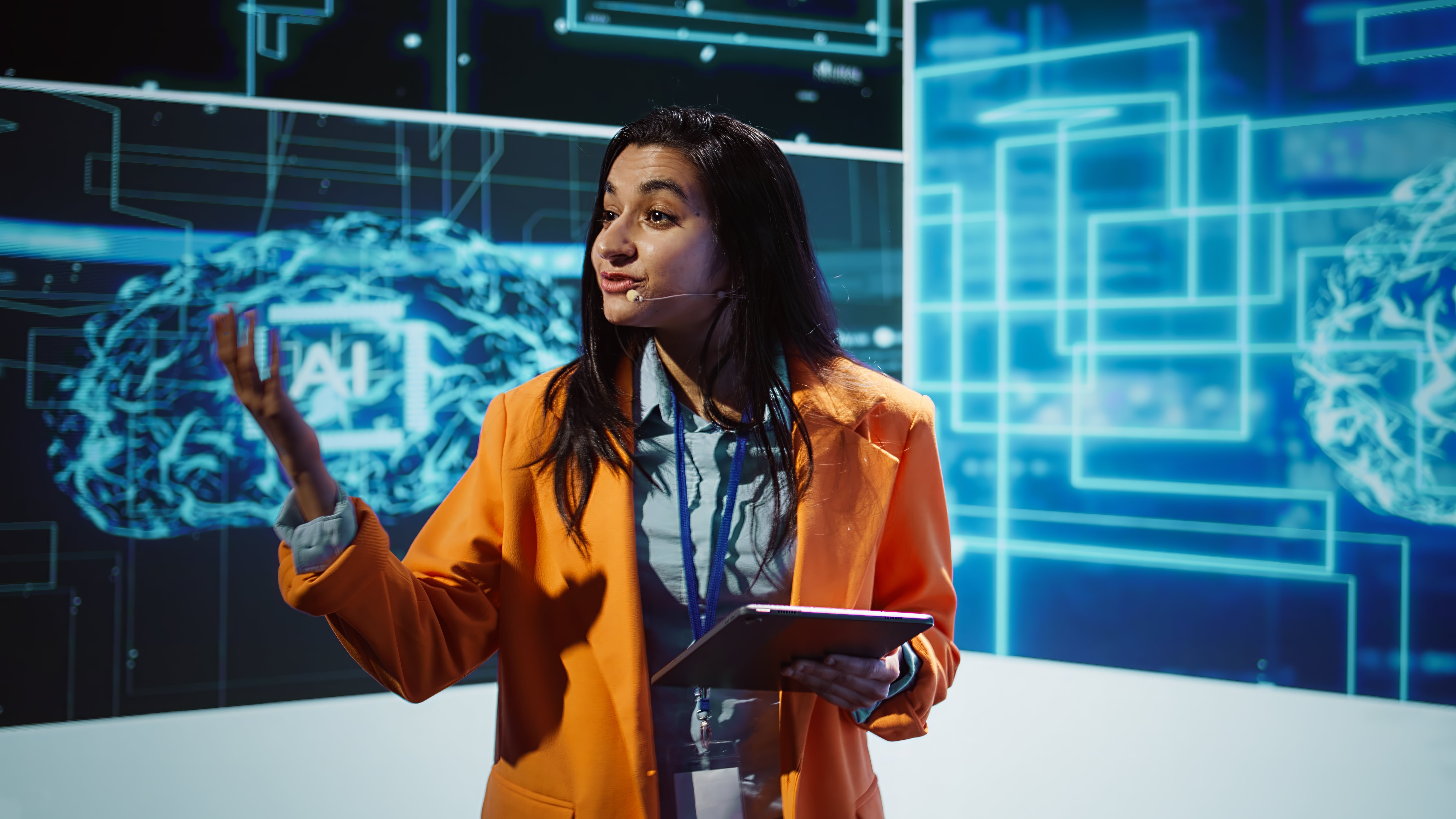 public-speaker-doing-presentation-tech-forum-event