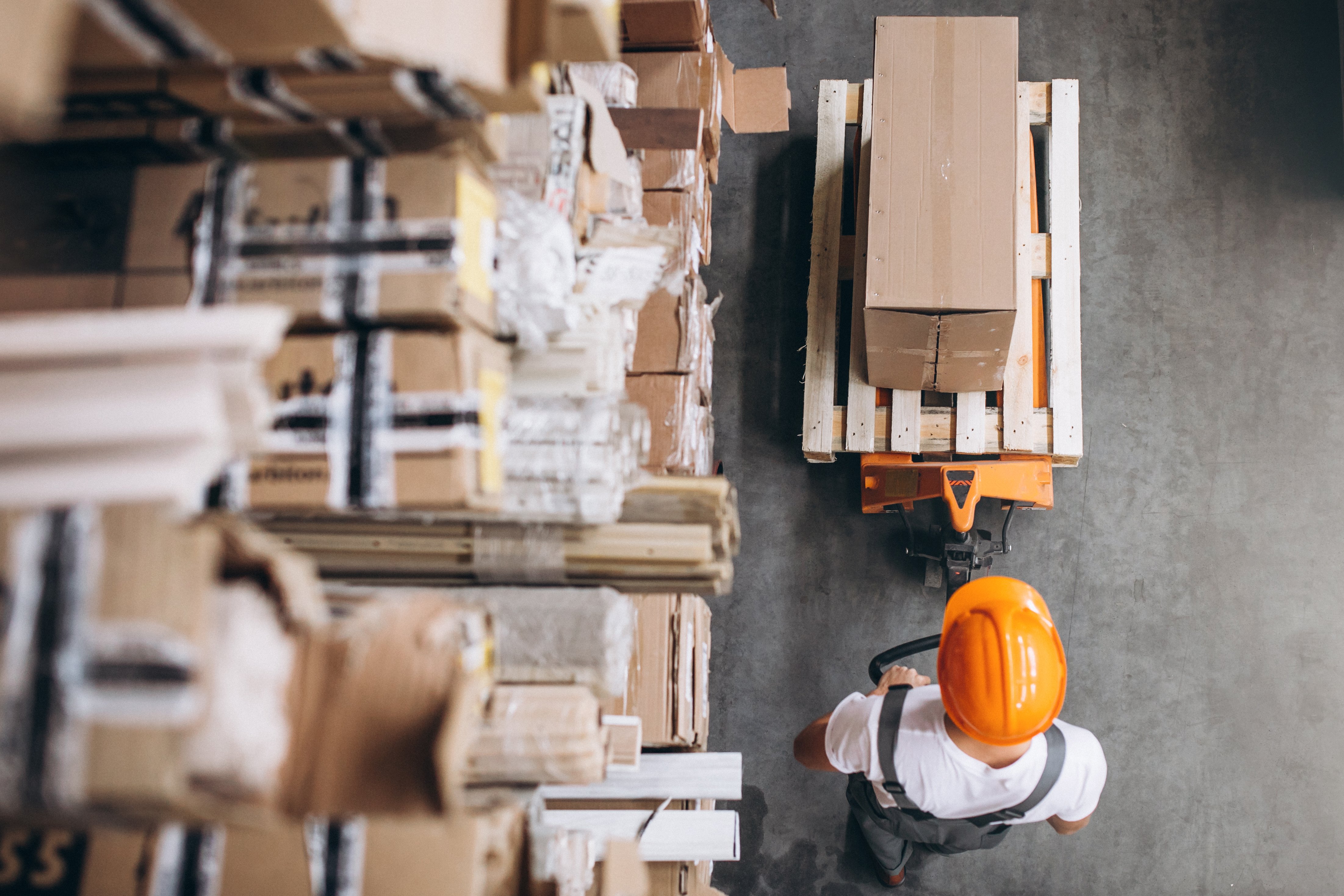 young-man-working-warehouse-with-boxes